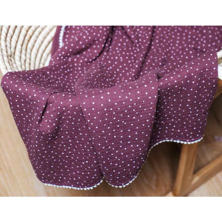 Dark plum polka dot pompon blanket for wholesale by Natural Cuddles