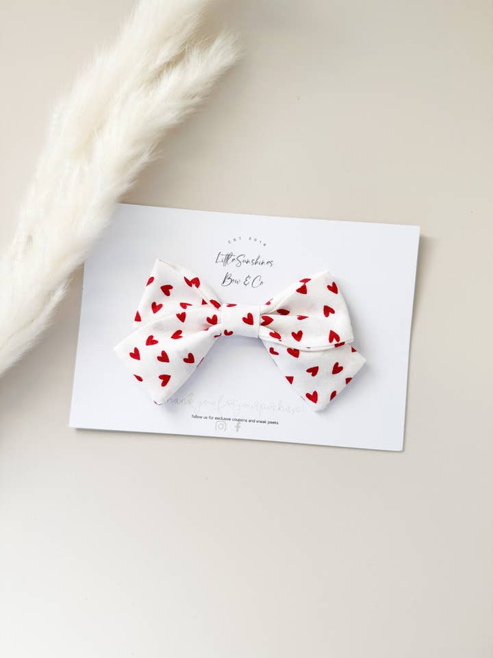 White & Red Hearts Valentines Day Pinwheel Bow for wholesale by Little Sunshines Bow & Co