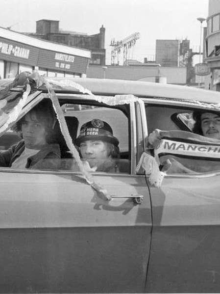 Manchester United football fans in Vauxhall Victor by Iain SP Reid - c, 1977 for wholesale by Flashback Shop