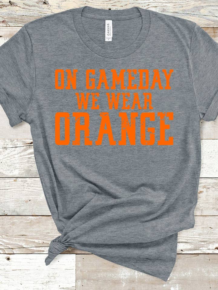 LE JOUR DU MATCH, ON PORTE DE L'ORANGE pour la vente par American Threadz Apparel