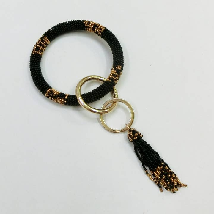 BLACK & GOLD SAINTS BRACELET KEYCHAIN for wholesale by Pizzazz, Inc.