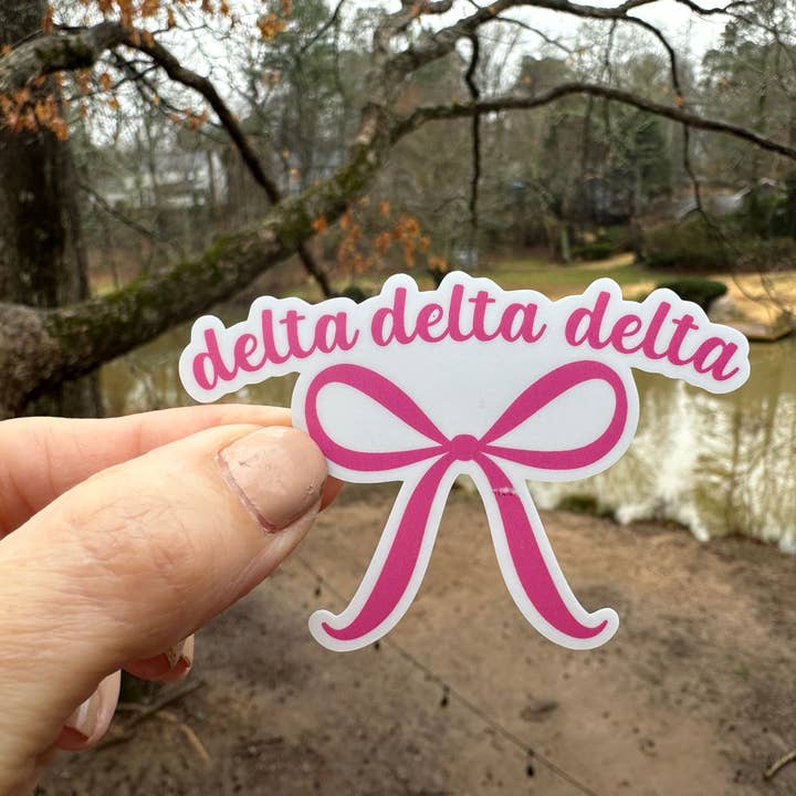 Sticker | DDD | Tri Detla Pink Bow | Waterproof Vinyl Sticker | White | Clear | Permanent | Removable | Window Cling | Glitter | Holographic for wholesale by My Vinyl Cut