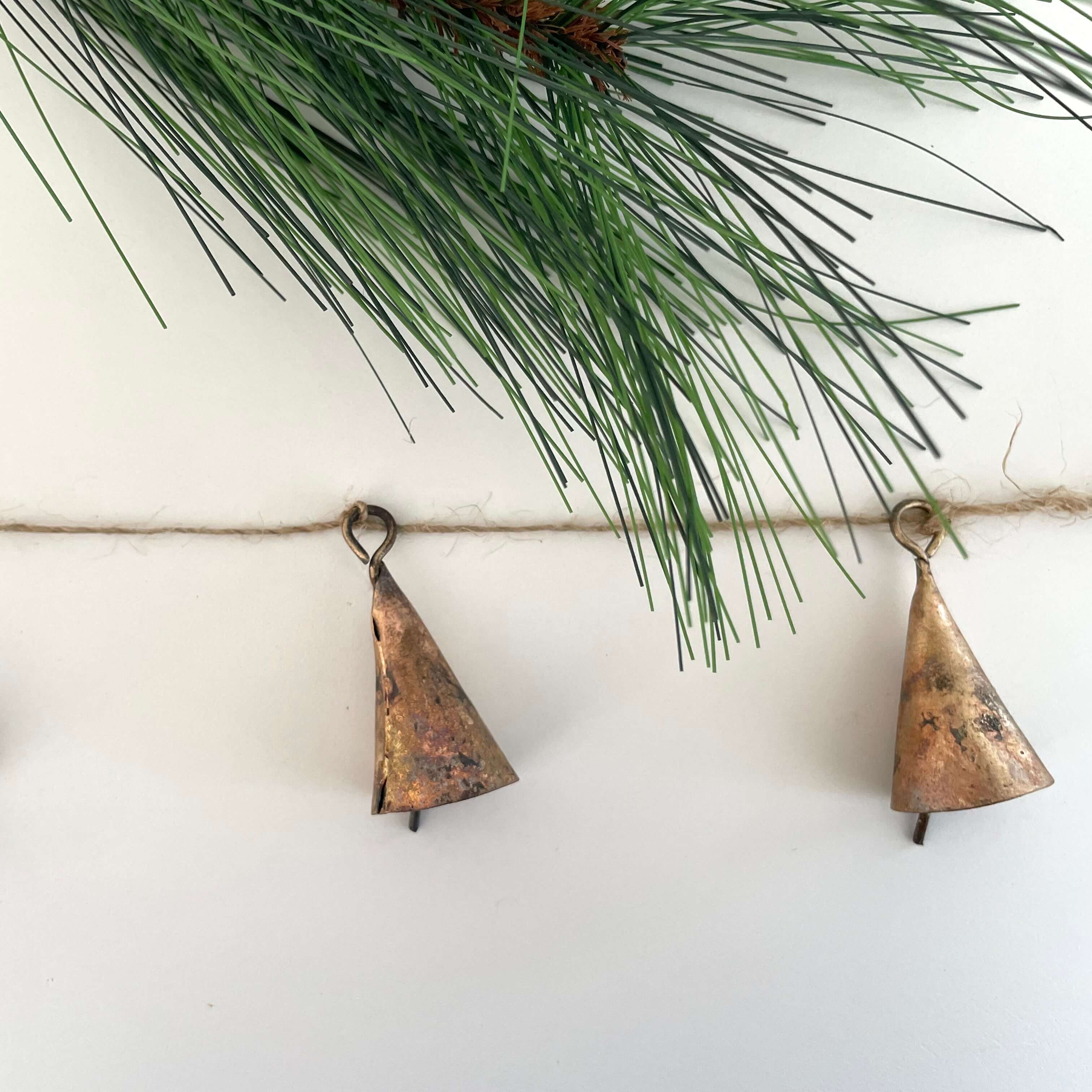 fort & field – wholesale Bunting/garland – Rustic tin cone shaped brass bell jute holiday garland3