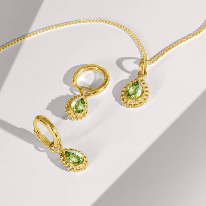 August Birthstone Huggie Hoops - Gold Peridot for wholesale by Charlotte's Web Jewellery