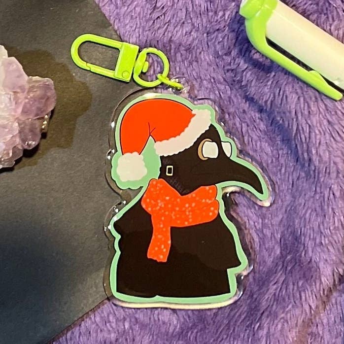 Plague Doctor Santa Hat Acrylic Keychain | Christmas Charm for wholesale by ChaoticPossumDesigns