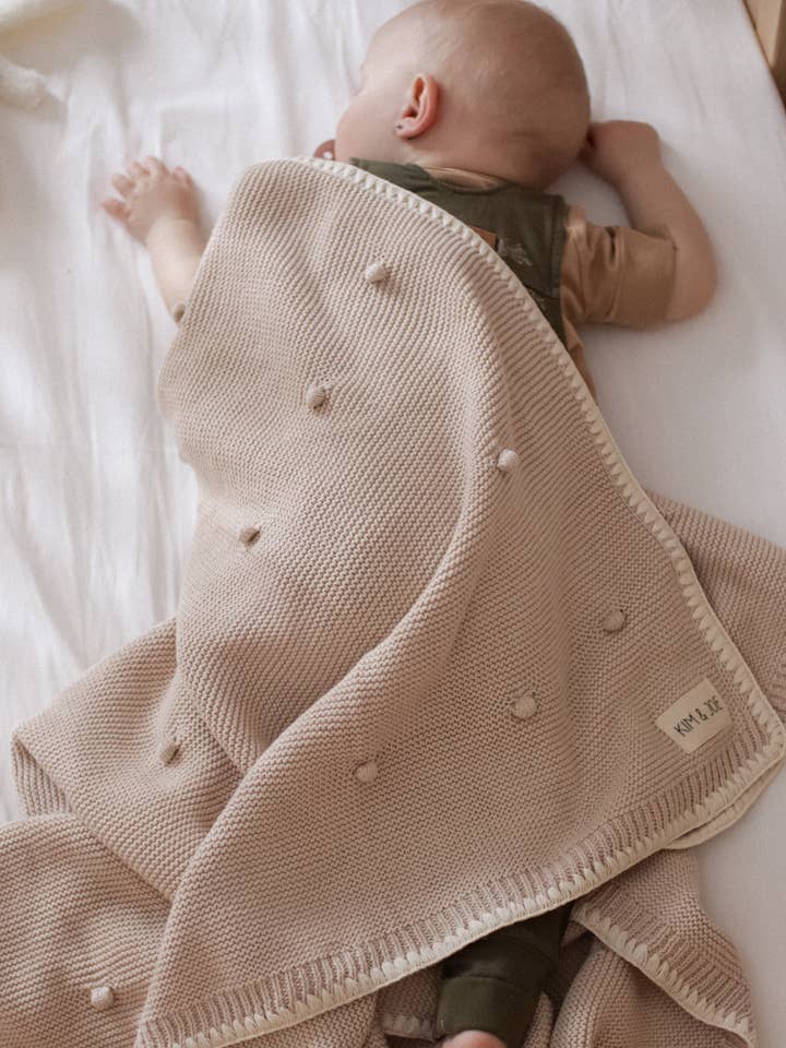 Crocheted comforter with beige polka dots for wholesale by Kim & Joe