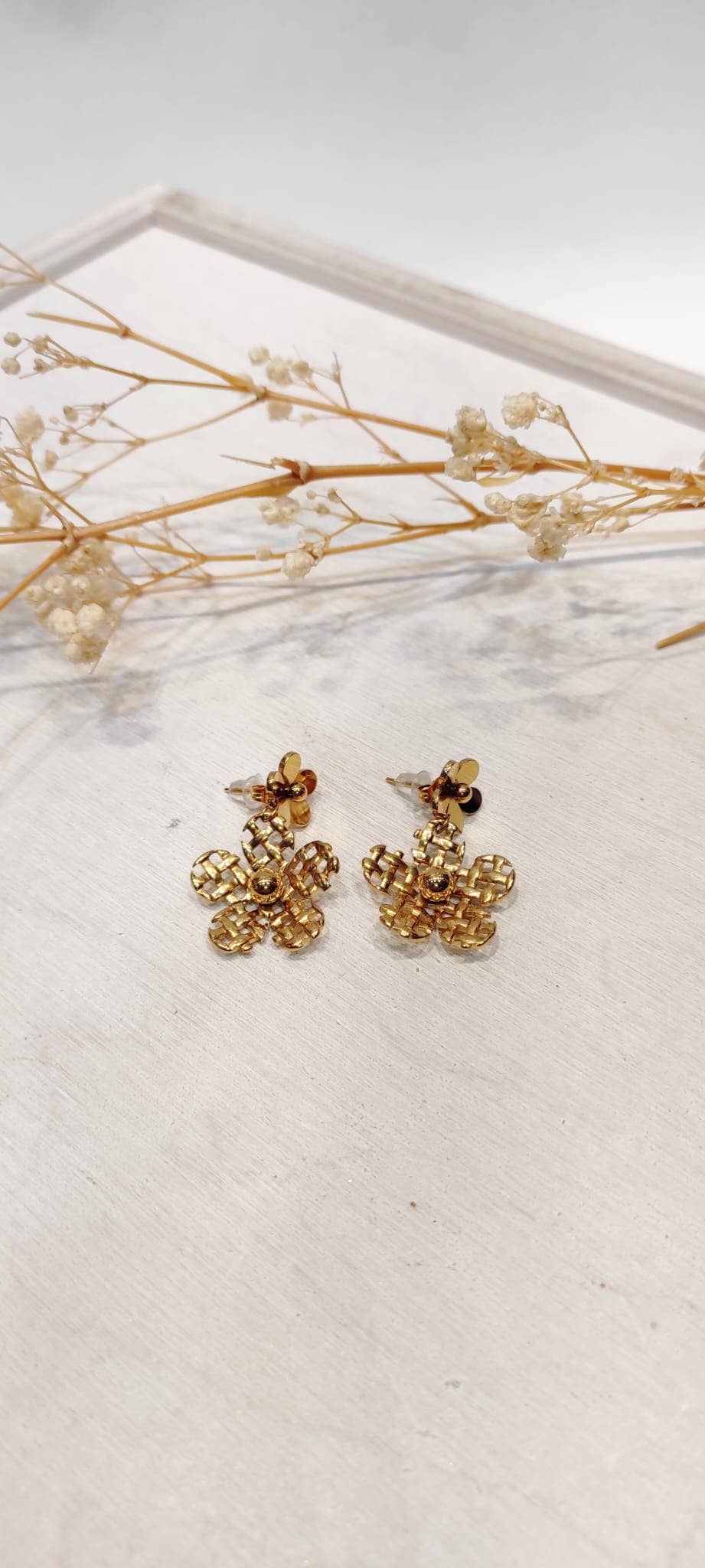 Gold Persephone flower earrings for wholesale on Faire