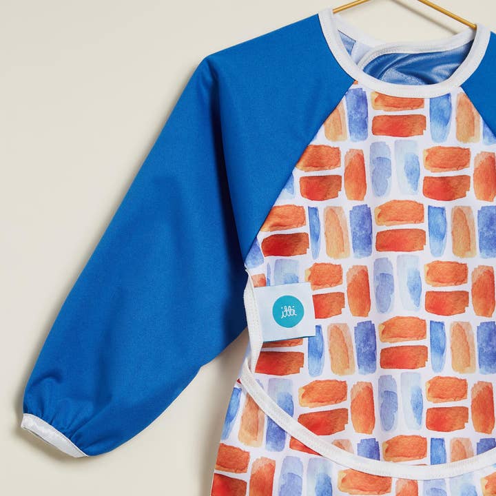 Grembiule/bavaglino con maniche - Flame per la vendita all'ingrosso da parte di Itti