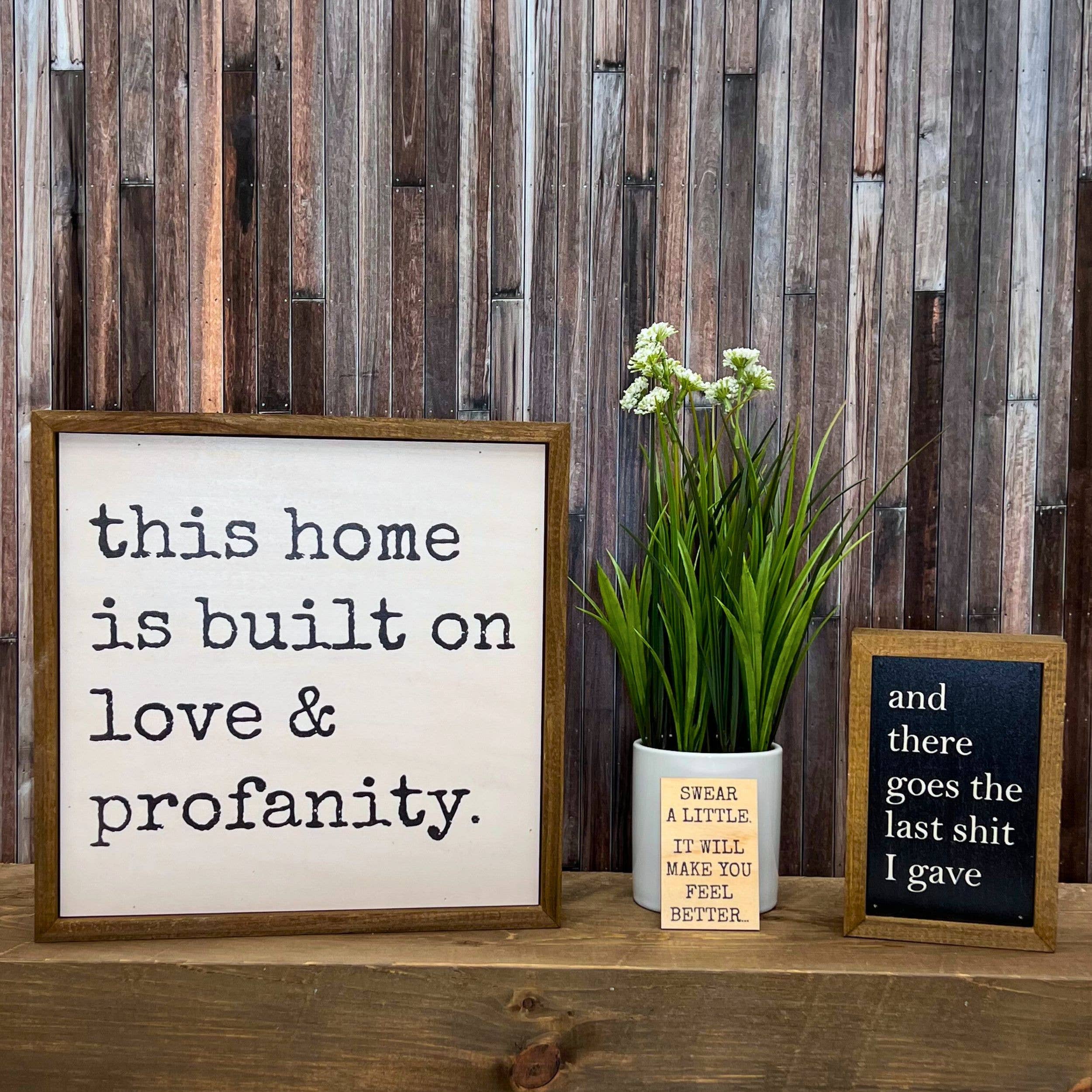 Driftless Studios - Wholesale Sign - This home is built on love & profanity. Funny Home Decor1