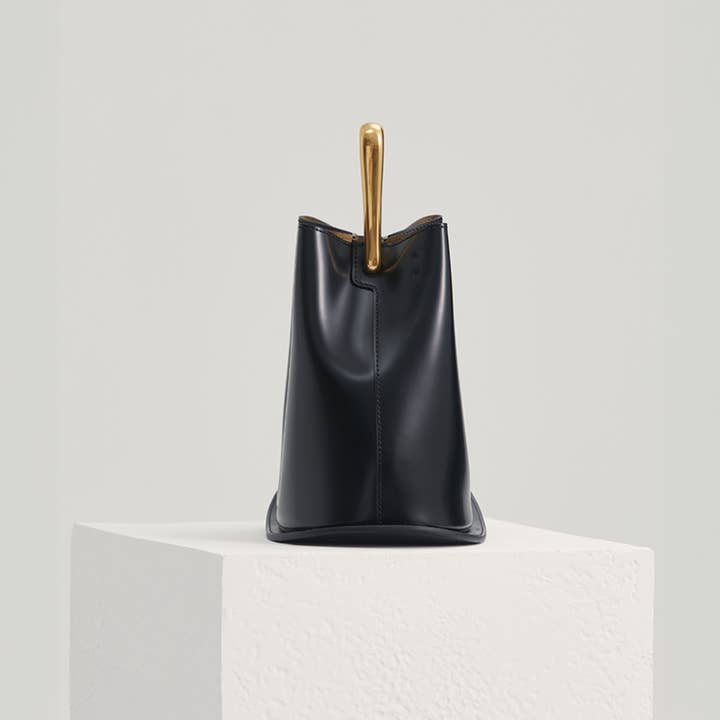 Ozzy Bag - Black & Gold for wholesale on Faire