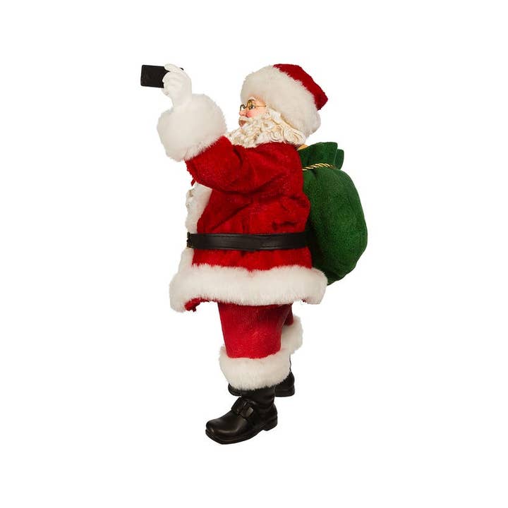 Kurt S. Adler, Inc. - Wholesale Christmas Decoration - 11"Fabriche Santa Taking Selfie