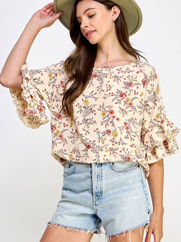 Top fleuri tissé à manches volantées pour la vente par Melon Fashion