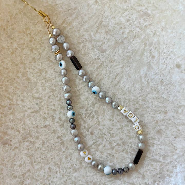 Olgis Multi Pearl & Stone telefonrem for engroshandel hos House of Olia