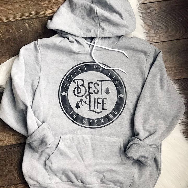 Living My Best Life in Wyoming Hooded Sweatshirt in Athletic Heather for wholesale by Living My Best Life in Wyoming