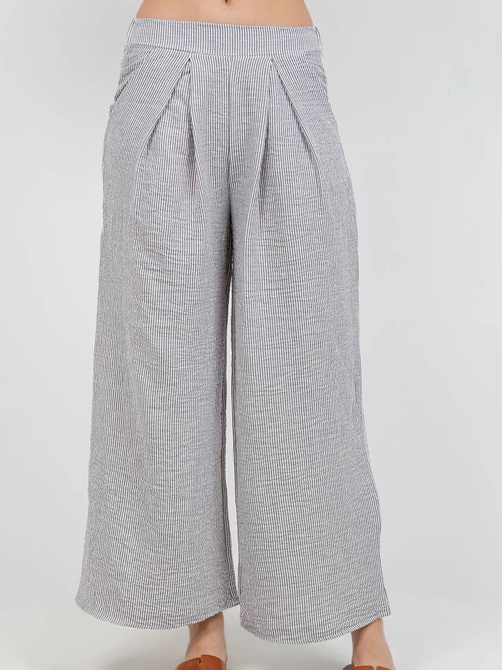 Byxbyxa med vida ben och fickor i linne-liknande material för wholesale av 24-Hrs Fashion