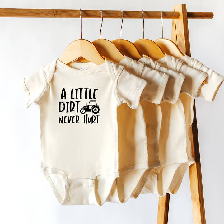 A Little Dirt Never Hurt | 100% Cotton Baby Bodysuit or Tee for wholesale by Wildflowers + Cotton