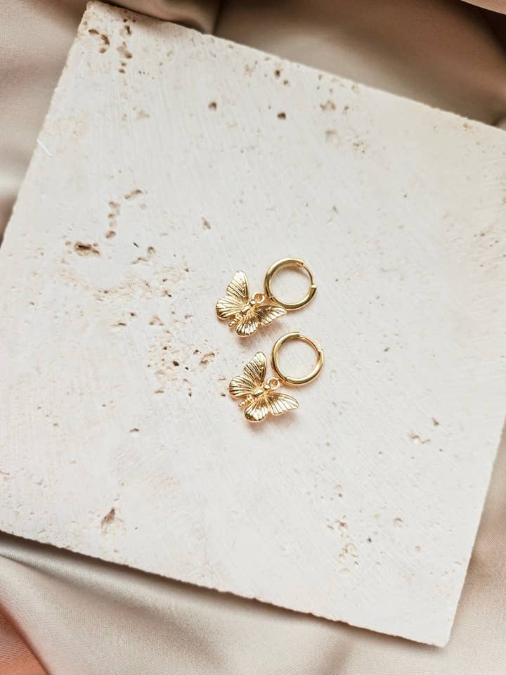 Gold Butterfly Huggie Hoops for wholesale by Lotus & Lace Designs