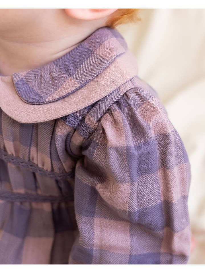 Lilac Smocked Peter Pan Gingham Baby Romper (Organic) for wholesale on Faire