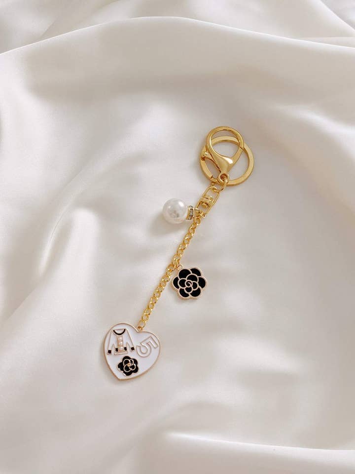 Coco de l'Amour Ikoniske Taske Charme I Hvid for engroshandel hos Ziaziari