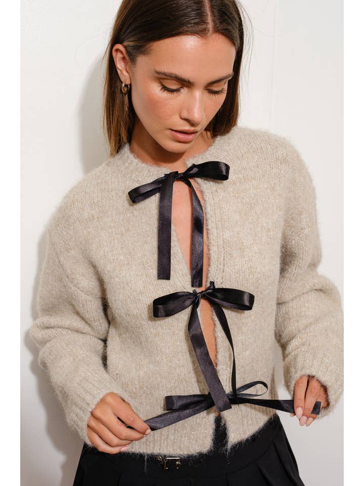 SAND SATIN BOW CARDIGAN for wholesale on Faire