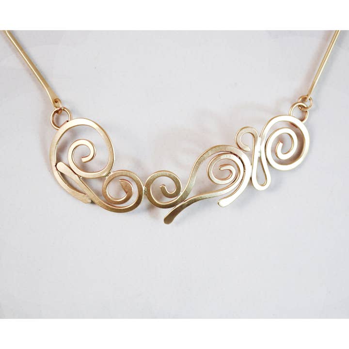 Swirls Brass Necklace for wholesale by Whitney Designs Ltd.