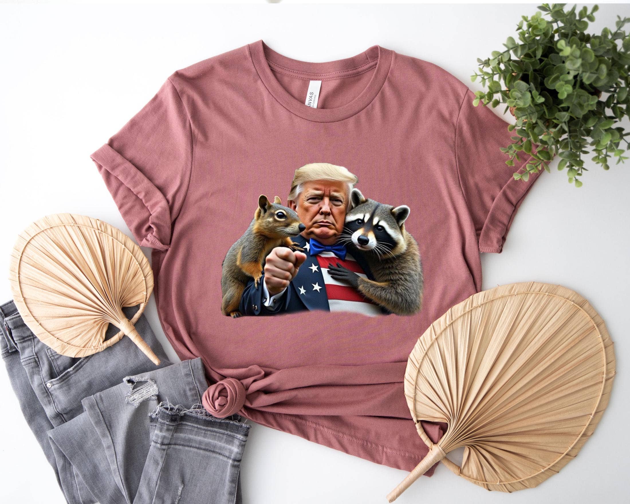 NVC Ecommerce LLC – wholesale T-shirt (graphic) – women's – Trump Peanut Squirrel Raccoon Sweatshirt, Funny Trump  Shirt1