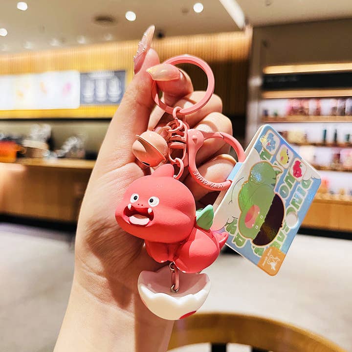 KiddieKickz - Wholesale Keychain – Child - Cartoon Dinosaur Holding Egg PVC Soft Keychain