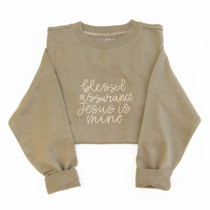 Sweatshirt à col rond brodé "Assurance Bénie" pour la vente par Love in Faith