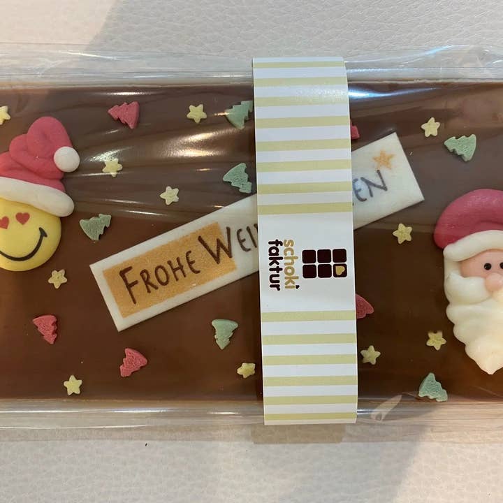Chocolate with Santa Claus, smiley, and sugar decoration for wholesale by Schokifaktur