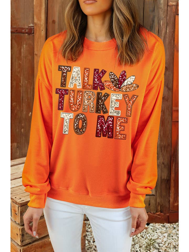 Orange TALK TURKEY TO ME Graphic Thanksgiving Holiday Sweatshirt for wholesale on Faire0
