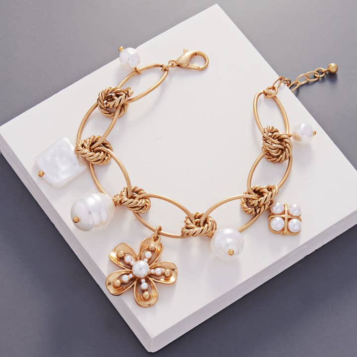 VG FLOWER SHAPED VINTAGE PEARL CHARM CLASP BRACELET for wholesale on Faire