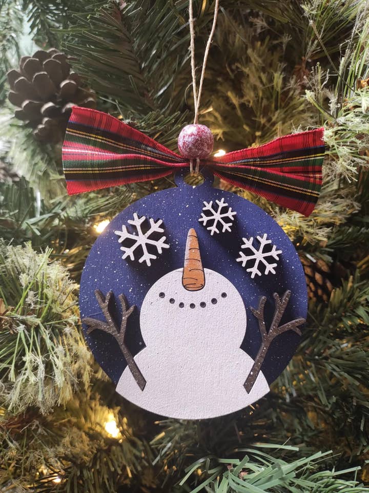 Falling Snow Snowman Ornament for wholesale by Heartland Decor