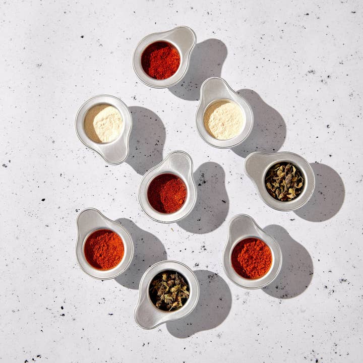 Occo - Vente Mélanges d'épices séchées - Nola sur une assiette de crevettes2