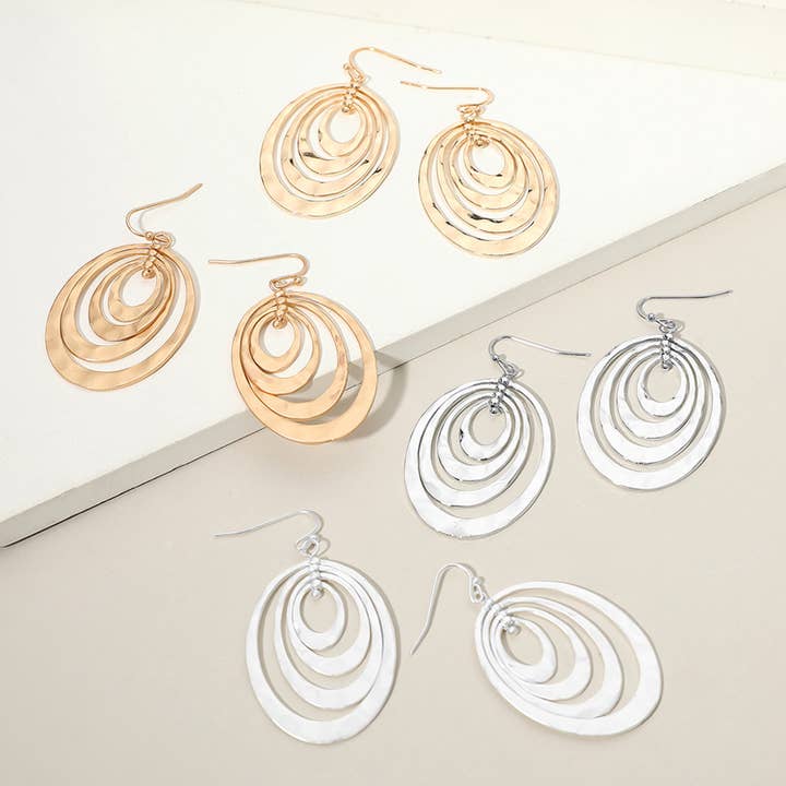 Boucles d'oreilles pendantes ovales concentriques en métal martelé pour la vente par Sensibling Corp.