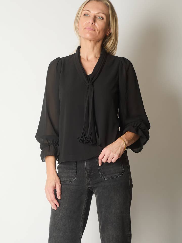 Tie Neck Long Sleeve Top with Ruffle Cuffs - Black for wholesale by SOLO