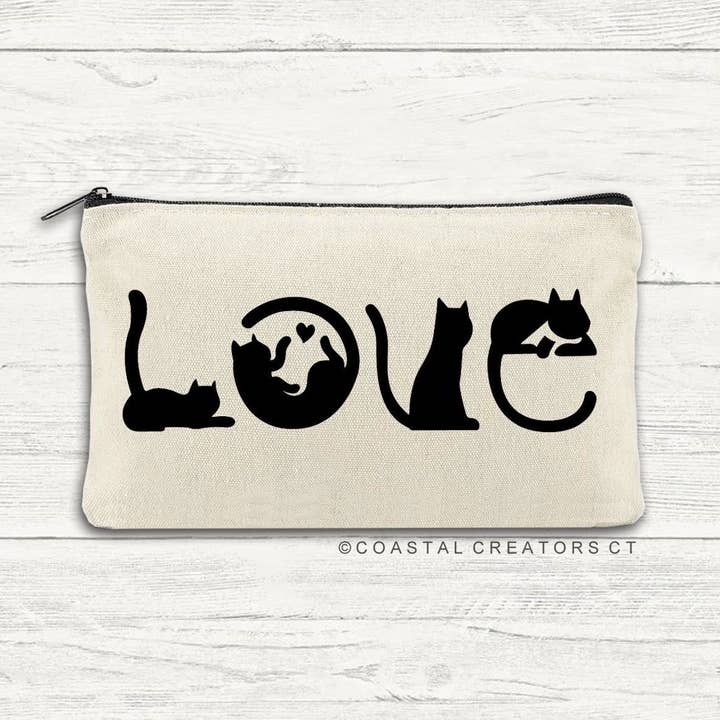 Cat Spells Love Multi-Purpose Canvas Travel Pouch (Packaged) for wholesale by Coastal Creators of Connecticut