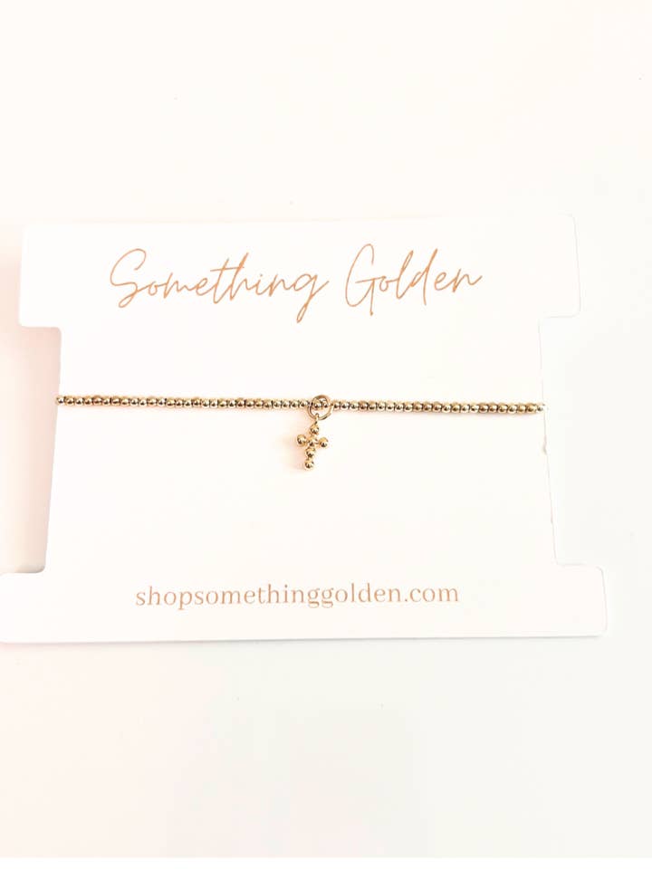 The Dainty Beaded Cross Charm Bracelet for wholesale by Something Golden