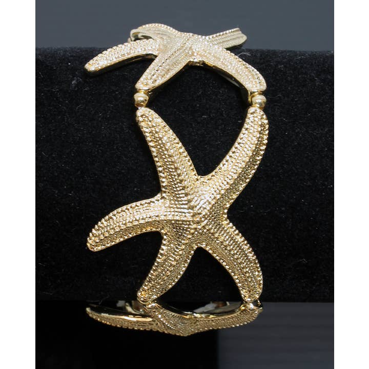 Chunky Gold Tone Starfishes Elasticated Bracelet for wholesale by Western Counties Wholesale