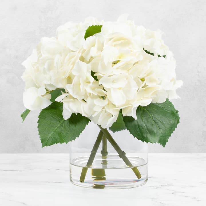 Faux hydrangea centerpiece arrangement in glass vase for wholesale by Vivian Rose LLC