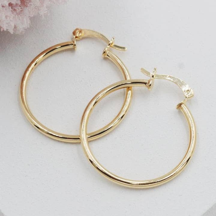 Orecchini a cerchio chiusi sottili per la vendita all'ingrosso da parte di Cherie by Cherie
