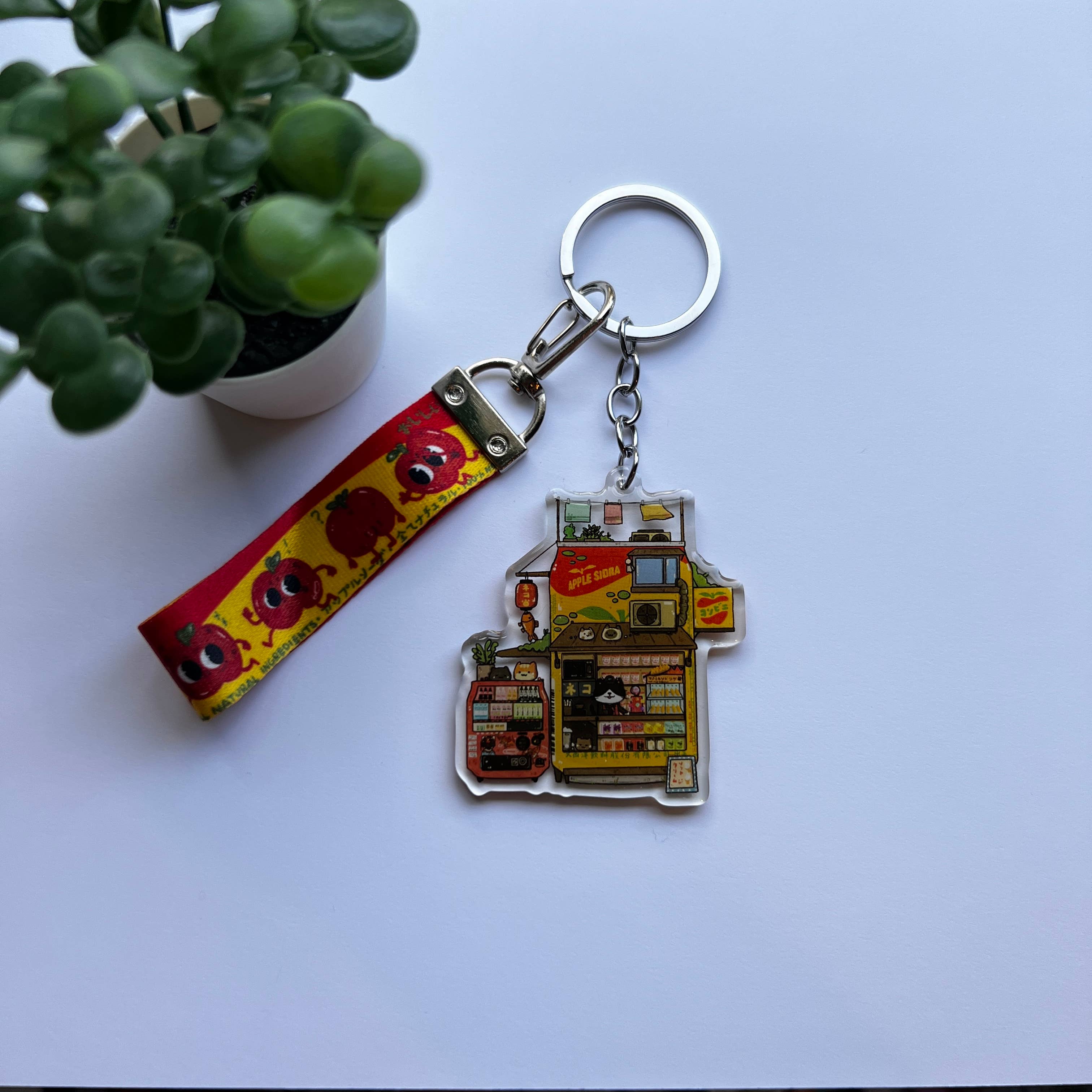 sushiboiiiyy - Venta al por mayor Llavero - Unisex - Llavero Apple Sidra Konbini con cordón