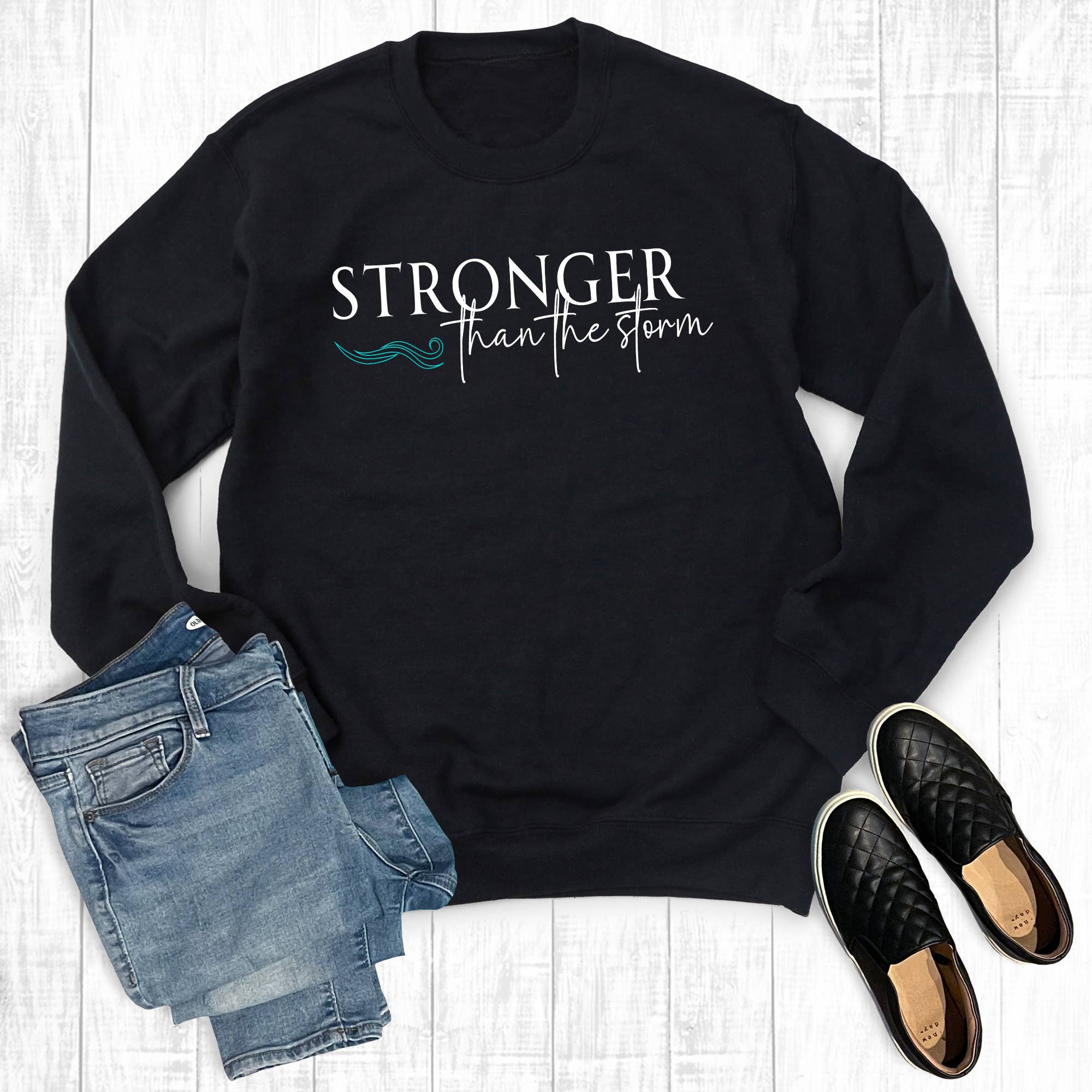 Black Faith Stronger Than The Storm Sweatshirt for wholesale on Faire0