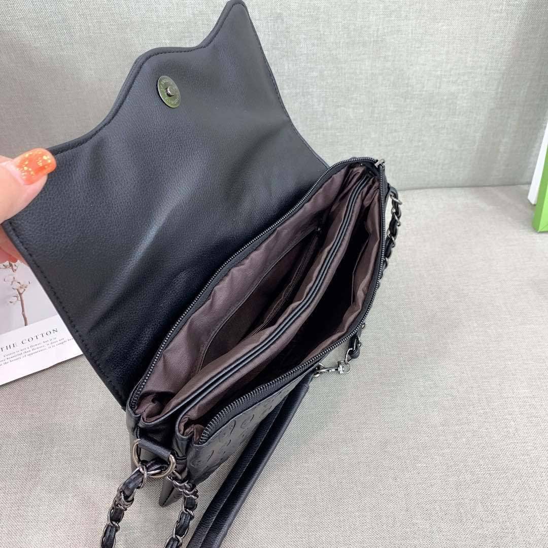 Black Embossed Riveted Skulls Shoulder Bag for wholesale on Faire5