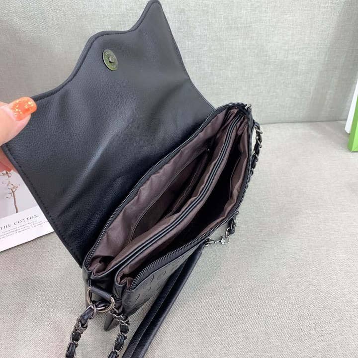 Black Embossed Riveted Skulls Shoulder Bag for wholesale on Faire5