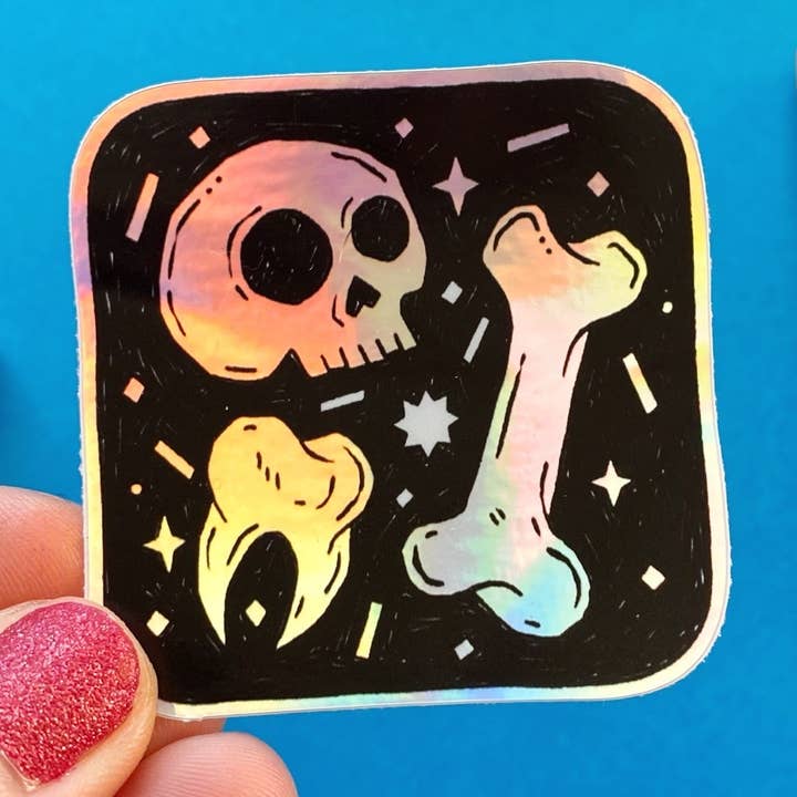 Skull and Bones Holographic Sticker for wholesale by Stacey McEvoy Caunt