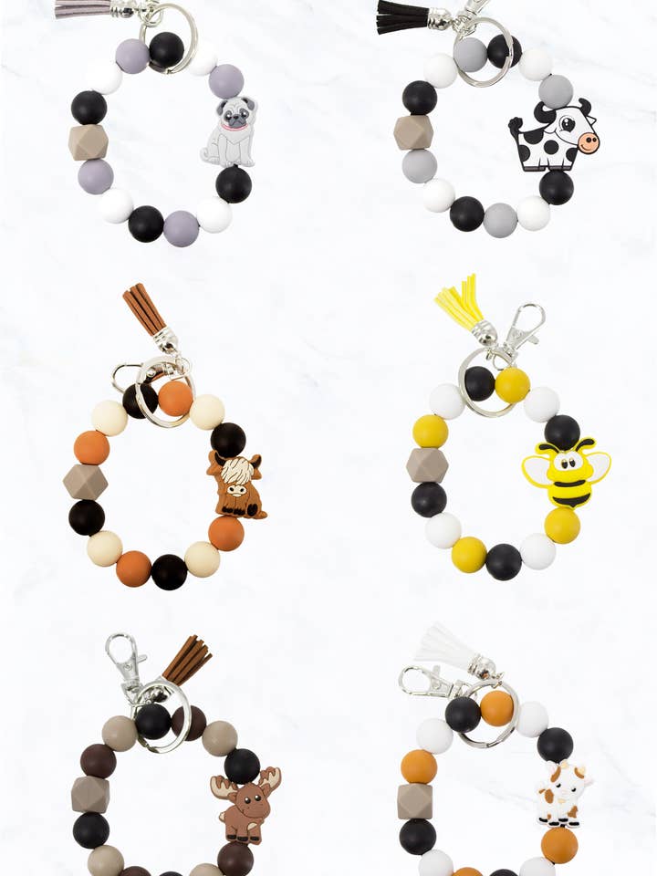 Porte-clés avec perles en silicone, breloque animal et pompon pour la vente par Suzie Q USA