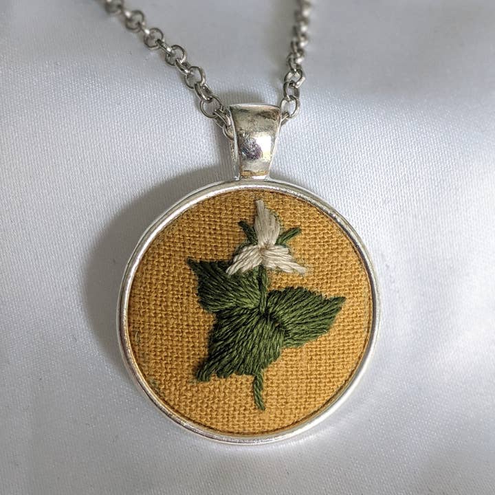 Hand-embroidered Trillium flower pendant for wholesale by Biobroidery