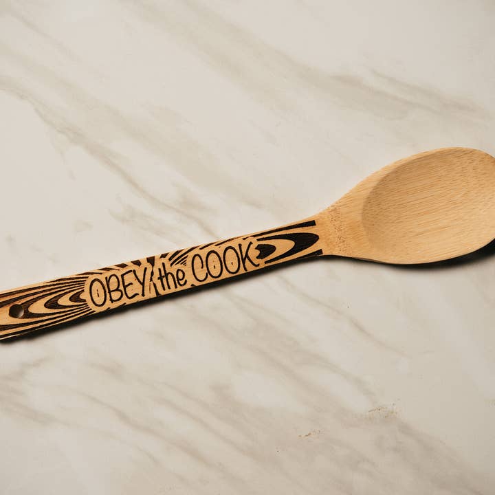 Obey the Cook (Spoon) for wholesale by Dom Chi Designs