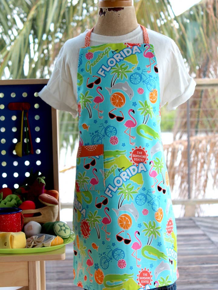 Tablier enfant Greetings From Florida pour la vente par The Blue Peony