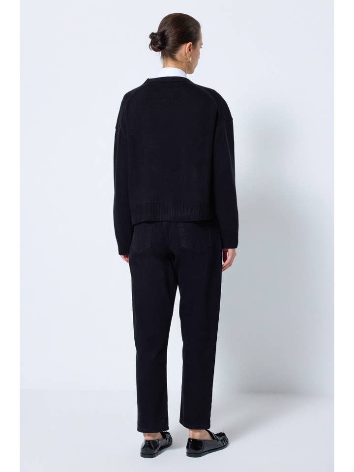 Black A KNIT CARDIGAN WITH BUTTON POCKET DETAILS for wholesale on Faire
